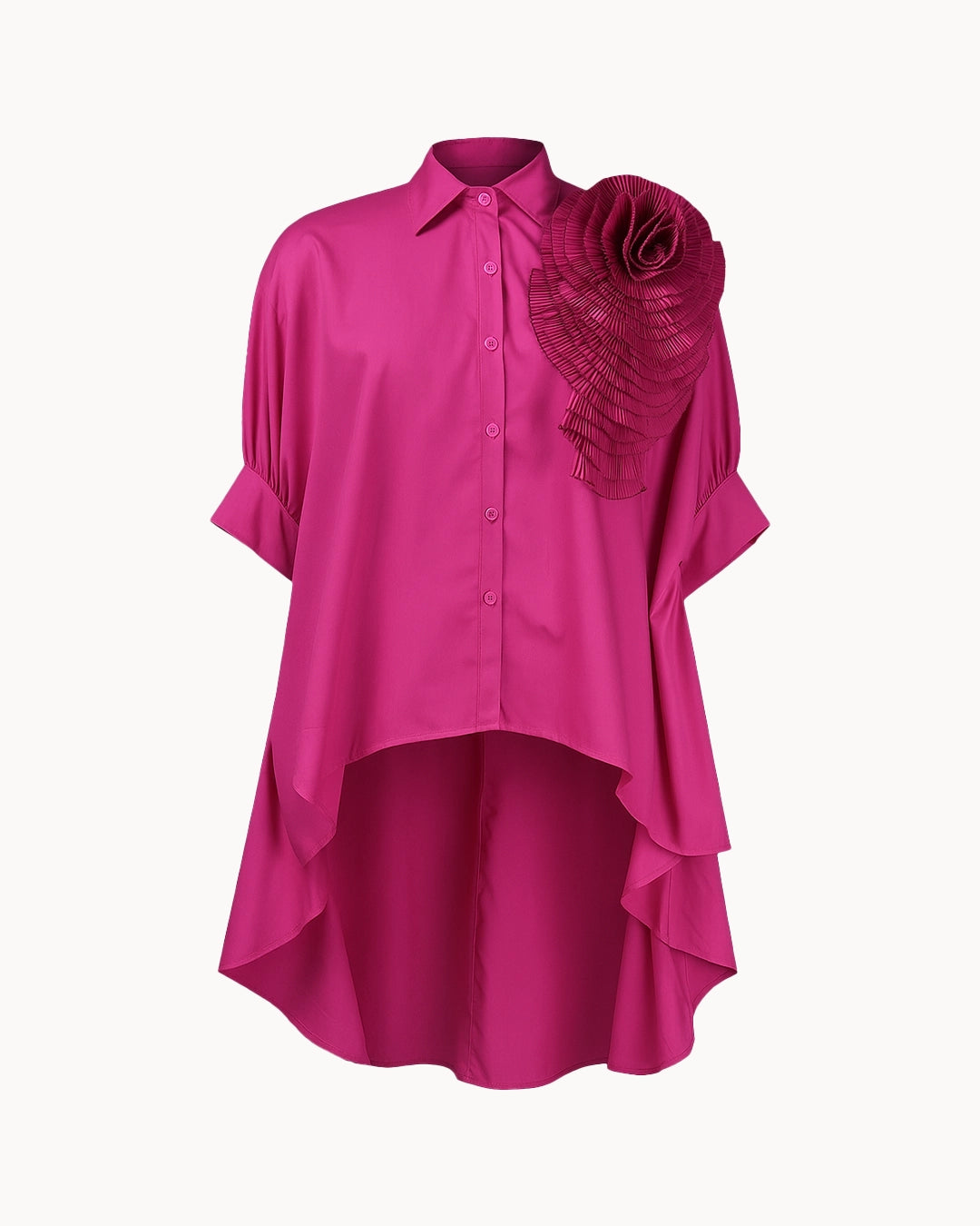 Pink blouse with a floral detail on a white background
