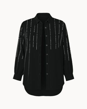 Black shirt with decorative elements on a white background