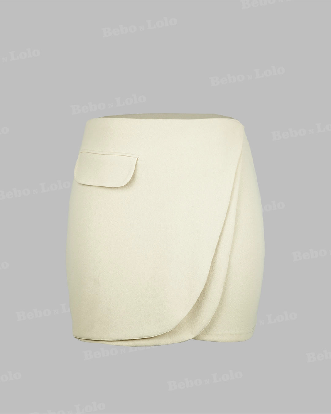 Beige skirt with a front pocket on a light gray background