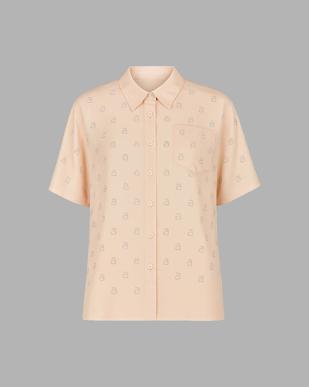 Beige short-sleeve shirt with subtle pattern on a gray background