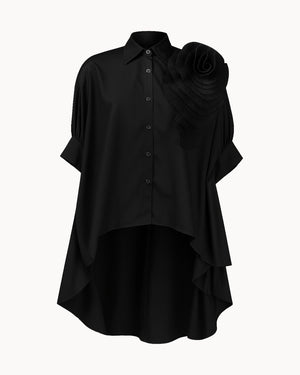 Black shirt with ruffled shoulder on a white background