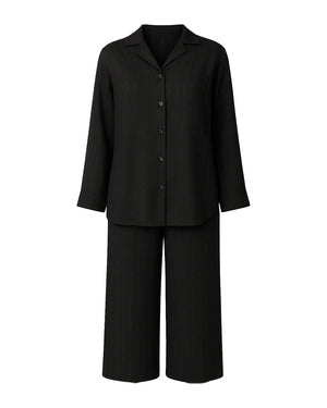 Black outfit with a jacket and pants on a white background