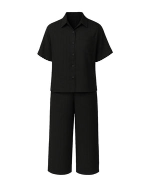 Black shirt and black pants set on a white background