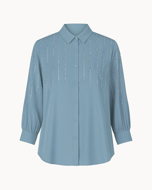 Light blue shirt with decorative elements on a white background