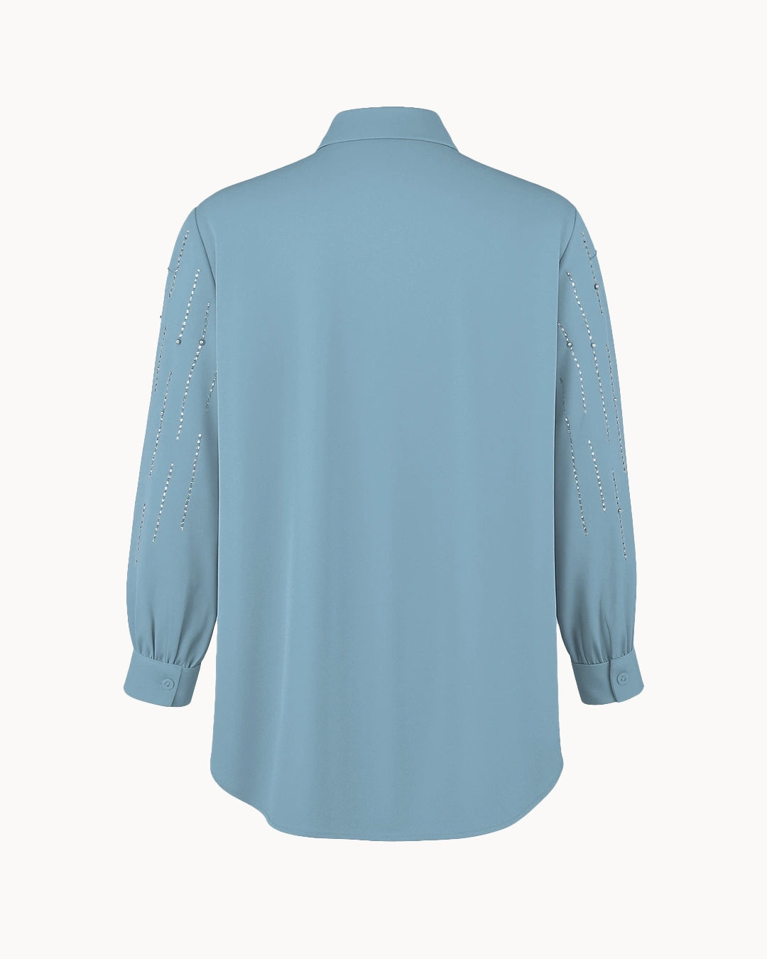 Light blue shirt with decorative sleeves on a white background