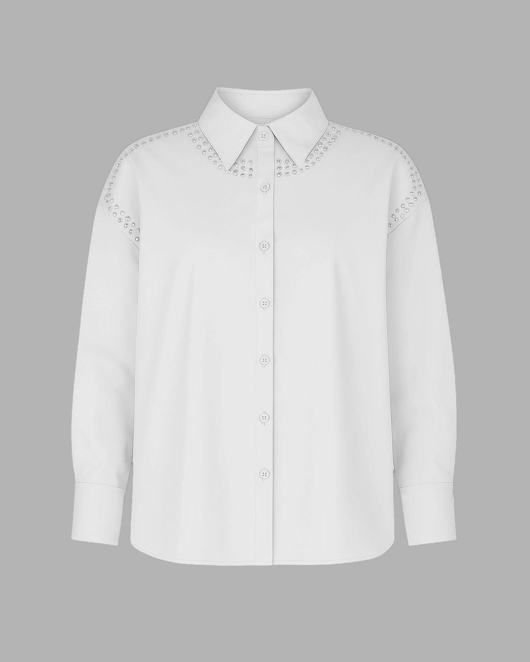 White shirt with intricate embroidery on a gray background