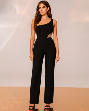 Woman wearing a black jumpsuit with cut-out design on a neutral background