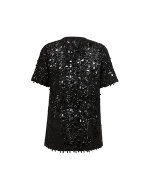 Black sequin dress on a white background