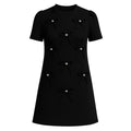 Black dress with bow details on a white background