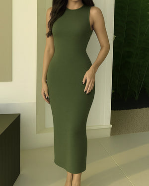 Woman wearing a green dress in an indoor setting
