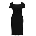 Black dress with scalloped hem on a white background