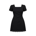 Black dress with lace hem on a white background