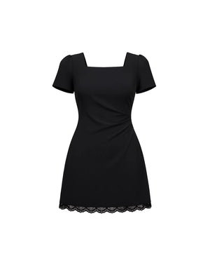 Black dress with lace hem on a white background