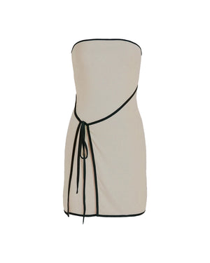 Beige strapless dress with black trim on a white background