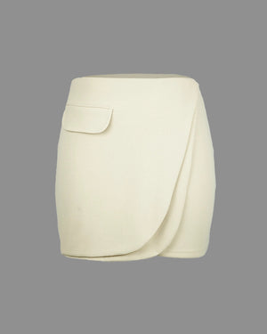 White skirt with a pocket on a gray background