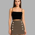 Woman wearing a black top and brown skirt with button details on a gray background, branded 'Bebó n Lolo'.