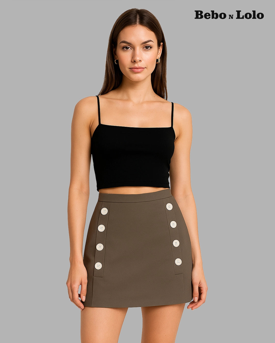 Woman wearing a black top and brown skirt with button details on a gray background, branded 'Bebó n Lolo'.