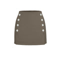 Green skirt with button details on a white background