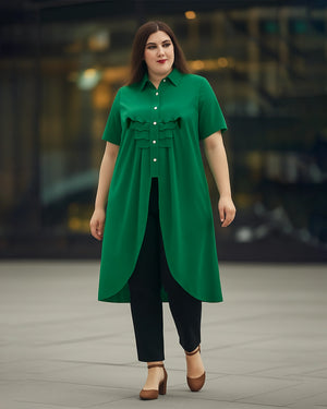 Woman wearing a green dress with a blurred background