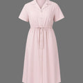 Pink dress with short sleeves on a gray background