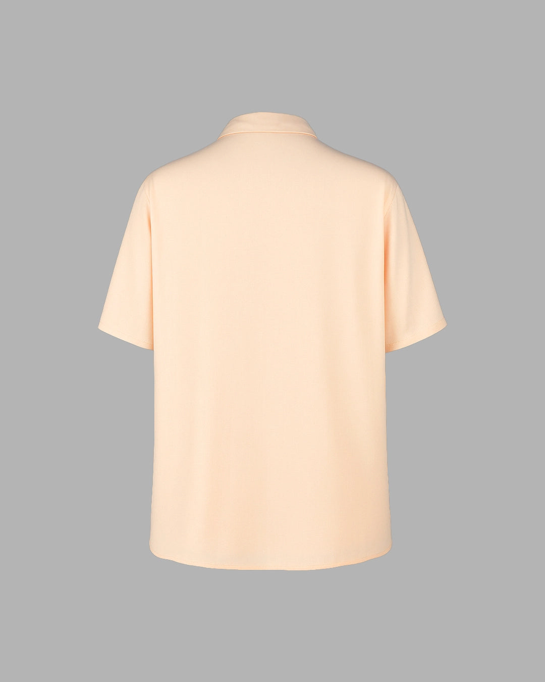 Beige t-shirt on a gray background