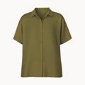 Green short-sleeve shirt with a subtle pattern on a white background