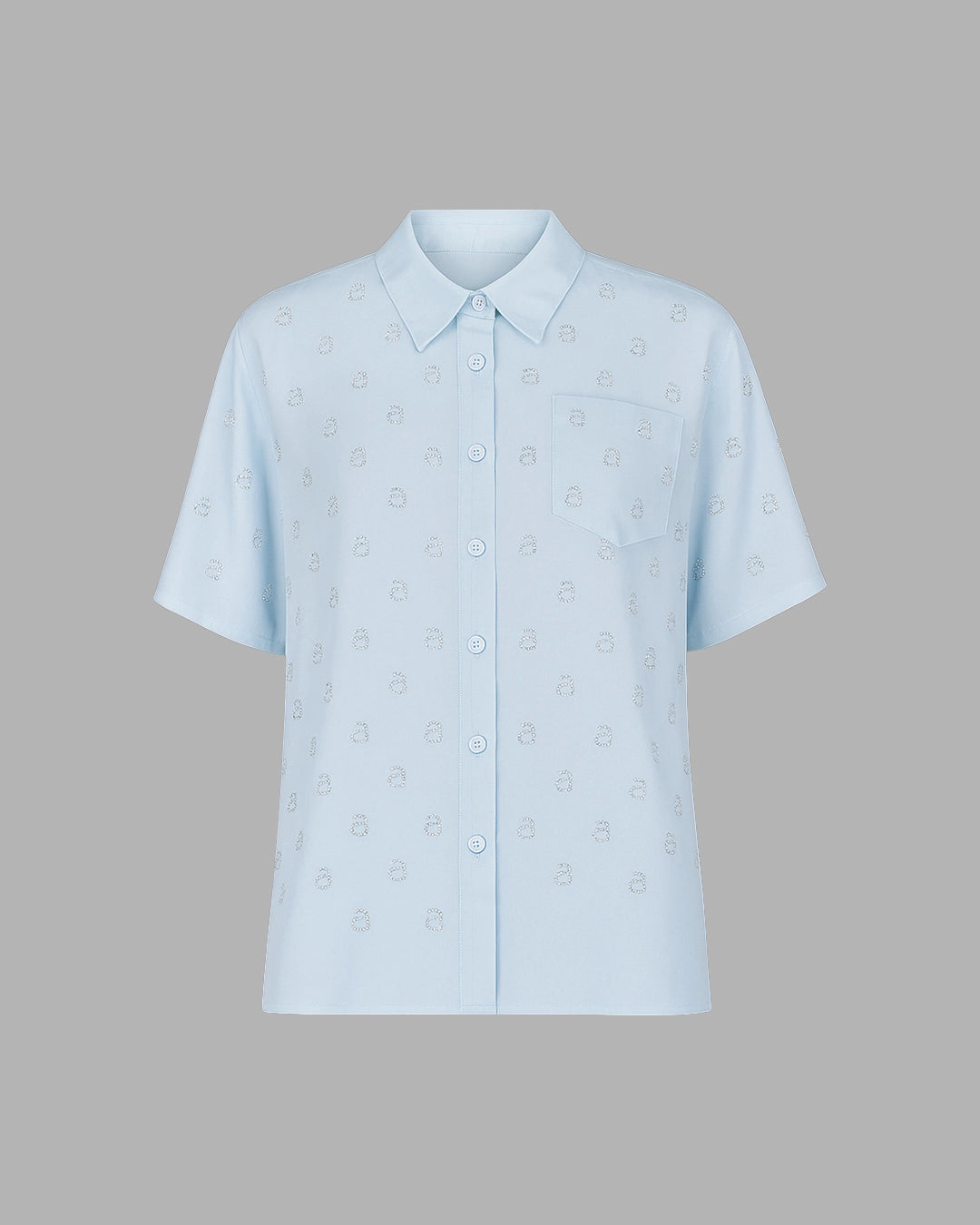 Light blue shirt with subtle pattern on a gray background