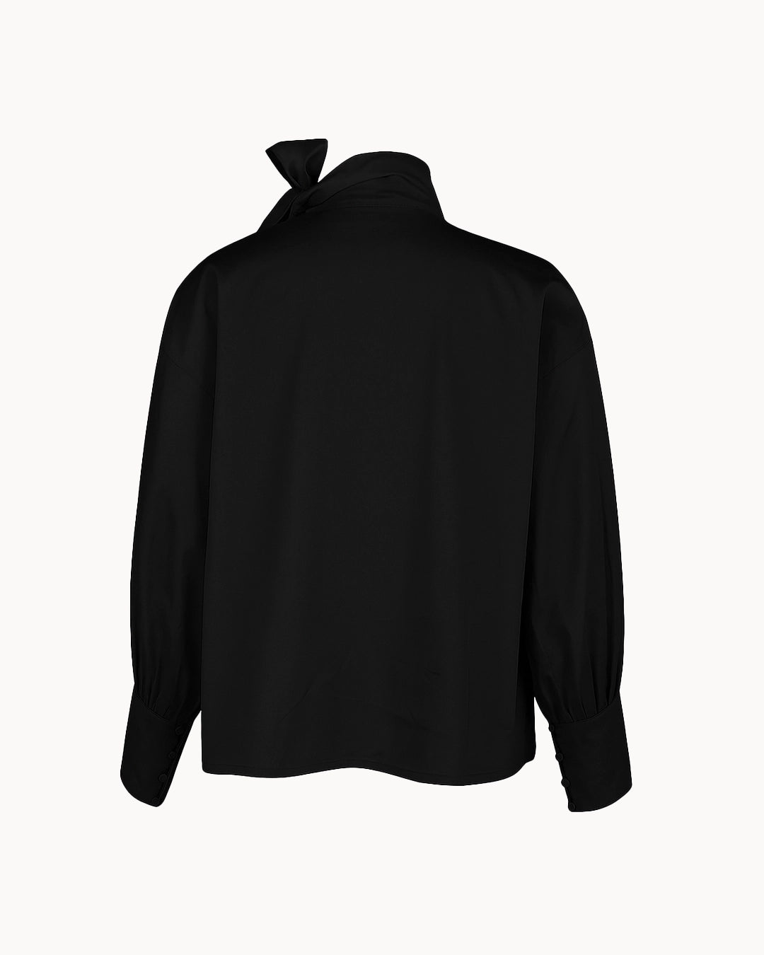 Black blouse with a bow detail on the back against a white background