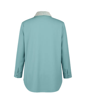 Light blue shirt with a patterned collar on a white background