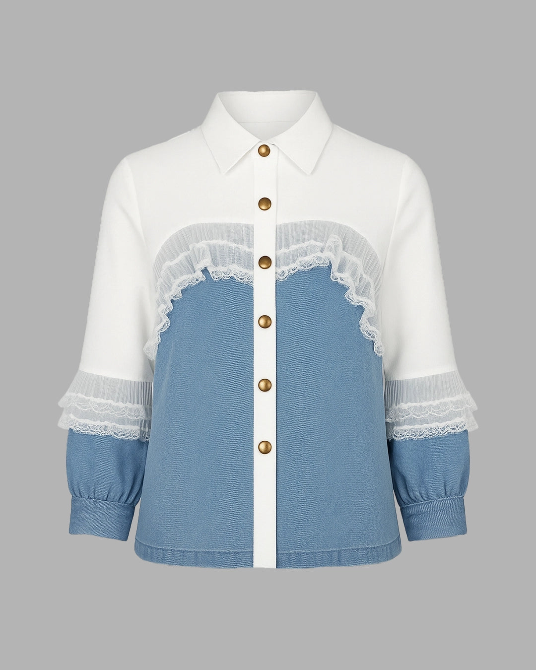 White shirt with blue denim panel and lace details on a gray background