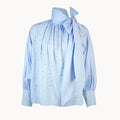 Light blue blouse with a tie detail on a white background
