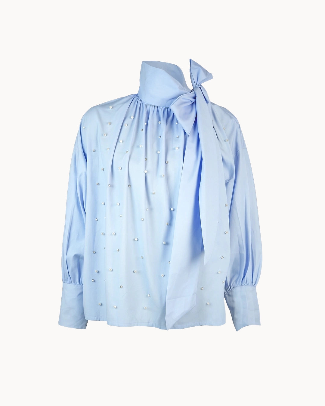 Light blue blouse with a tie detail on a white background