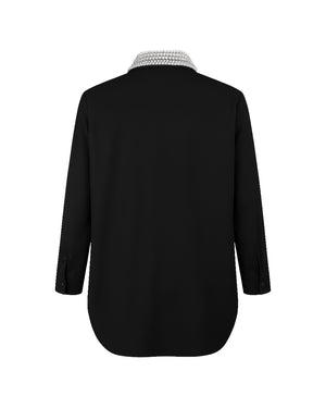 Black shirt with a textured collar on a white background