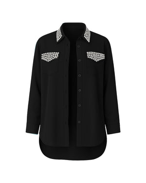 Black shirt with pearl embellishments on a white background