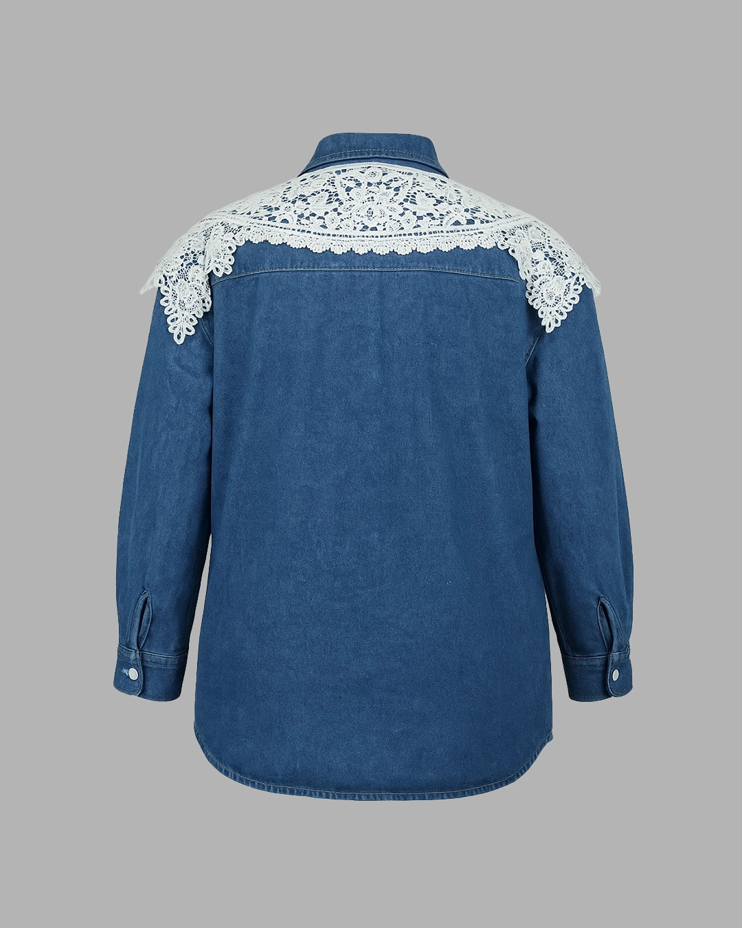 Blue denim shirt with white lace details on a gray background