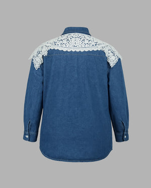 Blue denim shirt with white lace details on a gray background