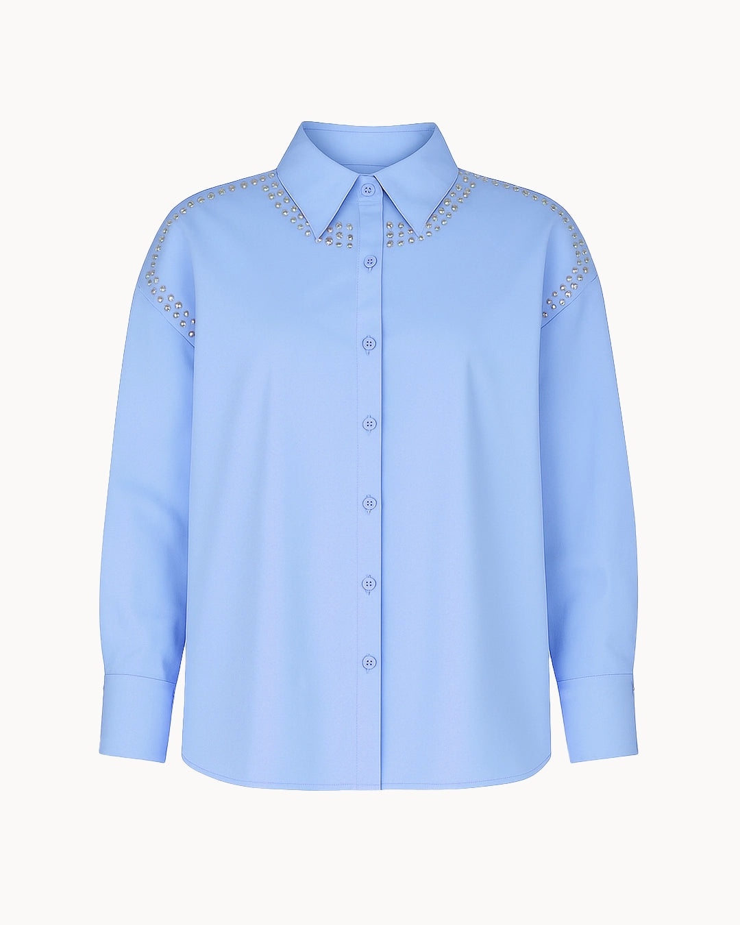 Light blue shirt with decorative details on a white background