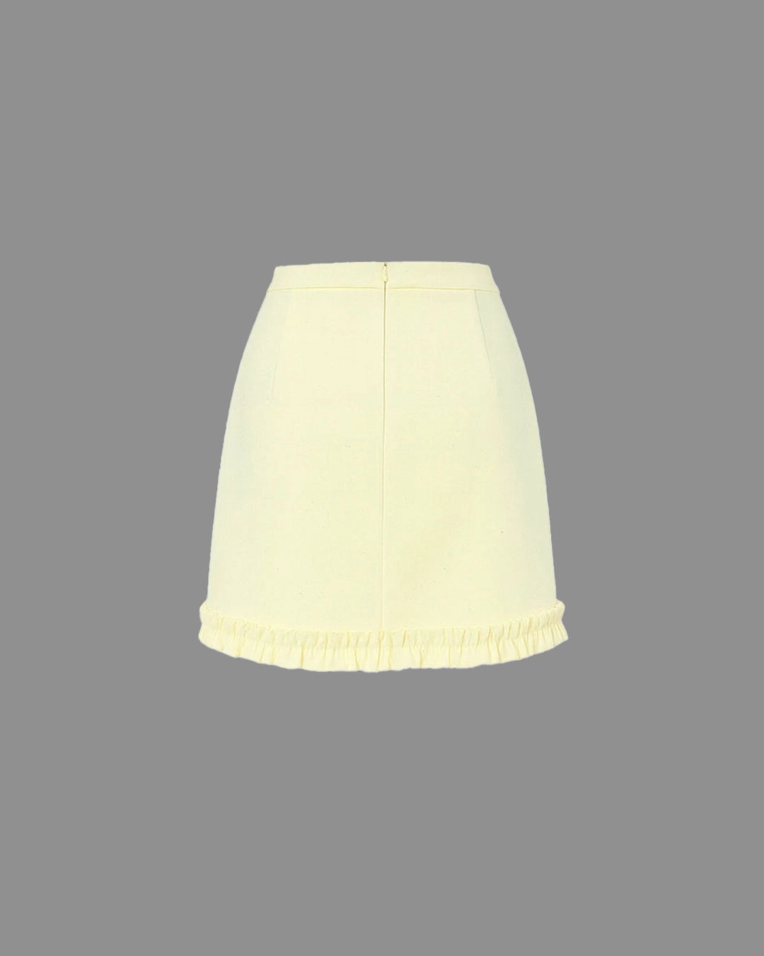 Light yellow skirt on a gray background