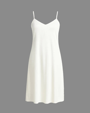 White slip dress on a gray background