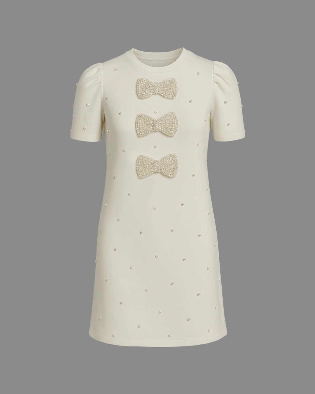 White dress with bow details on a gray background