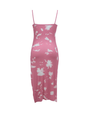 Pink slip dress with white floral pattern on a white background