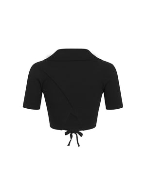 Black cropped top with a tie detail on a white background