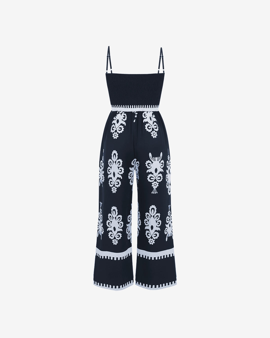 Navy blue jumpsuit with white floral patterns on a white background