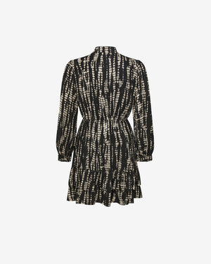 Black and white patterned dress on a light gray background