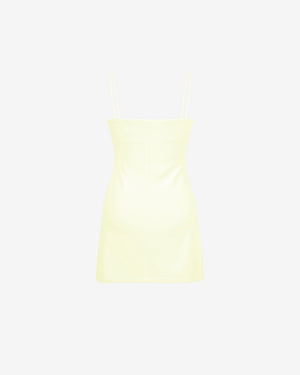 Light yellow strapless top on a light gray background