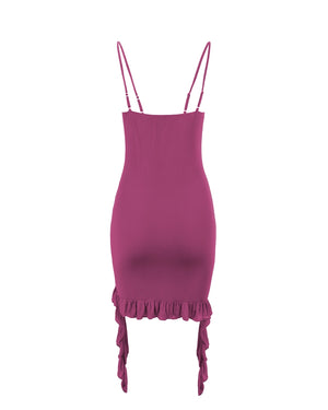 Magenta dress with thin straps and ruffled hem on a white background