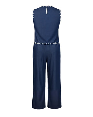 Navy blue jumpsuit with decorative trim on a white background