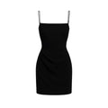 Black slip dress on a white background