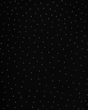 Black fabric with small white polka dots