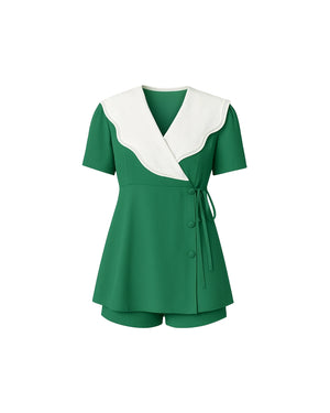 Green outfit with white collar on a white background